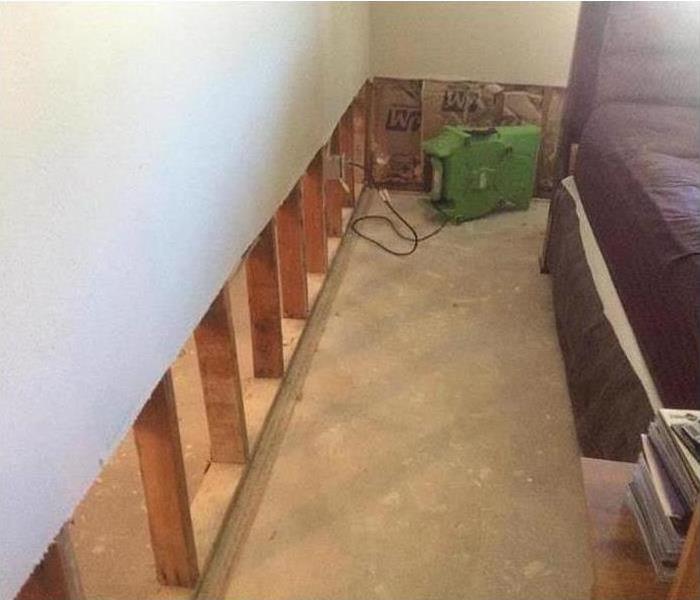 Flood cut performed on a drywall, air mover placed on direction to drywall