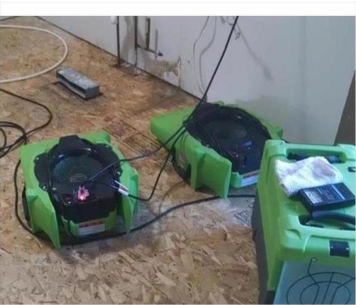 Two air movers placed on the floor